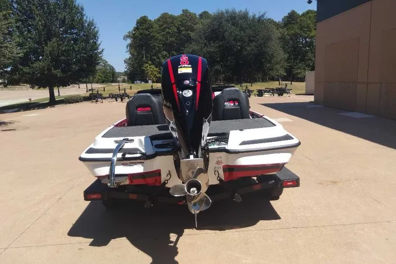 Slide: The Image of 2027 Nitro Z18 XL Pro boat with powerful outboard motor, parked outdoors. - 7