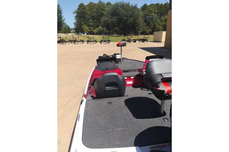 Slide: The Image of 2027 Nitro Z18 XL Pro boat with seating and control panel, parked outdoors. - 11