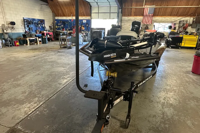 Slide: The Image of 2027 Tracker Pro Team 175 boat in a workshop with tools and equipment. - 63