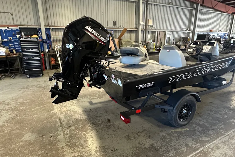 Slide: The Image of 2027 Tracker Pro Team 175 boat with Mercury engine in a workshop setting. - 54