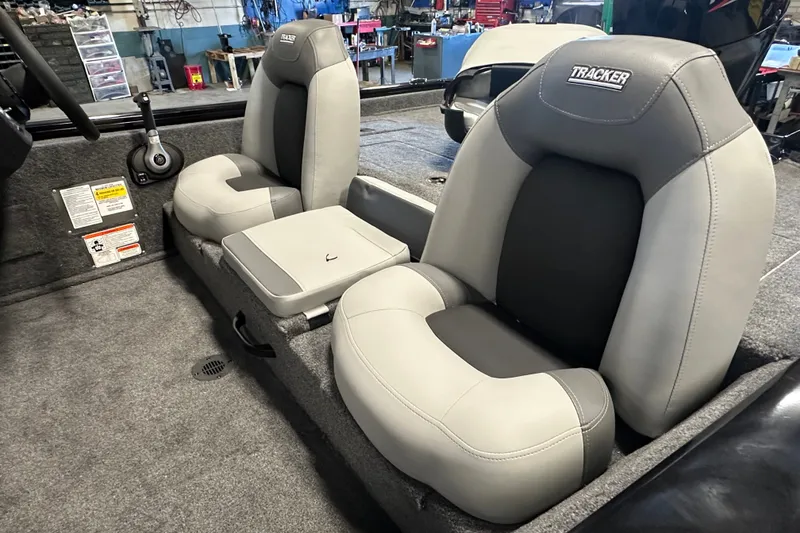 Slide: The Image of Interior of 2027 Tracker Pro Team 175 boat with gray seating and controls. - 61