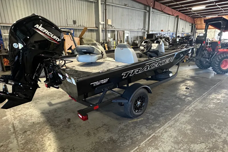 Slide: The Image of 2027 Tracker Pro Team 175 boat in a warehouse with Mercury engine. - 52