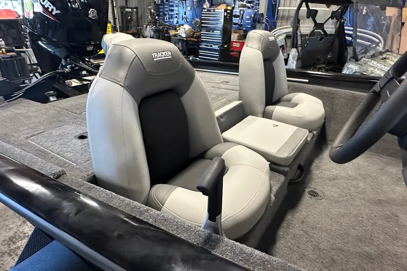 Slide: The Image of 2027 Tracker Pro Team 175 boat interior with gray seating and steering wheel. - 58