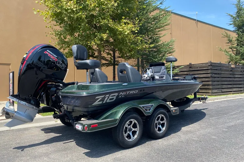 Slide: The Image of 2027 Nitro Z18 XL Pro boat with Mercury Pro XS engine, parked outdoors. - 1