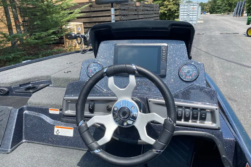 Slide: The Image of Steering console of 2027 Nitro Z18 XL Pro boat with modern controls and dashboard. - 4