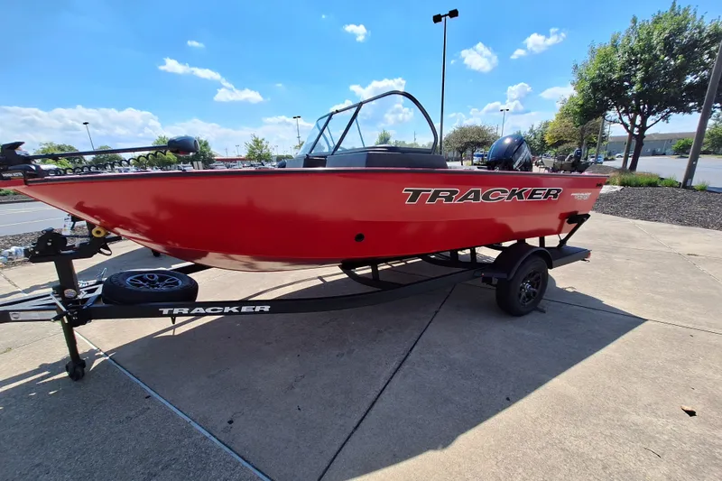 The Image of 2026 Tracker Pro Guide V-175 WT boat on trailer, vibrant red, parked outdoors. - 0