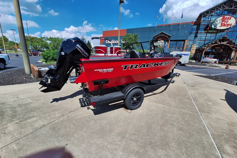 Slide: The Image of 2026 Tracker Pro Guide V-175 WT boat displayed outside Bass Pro Shops. - 60