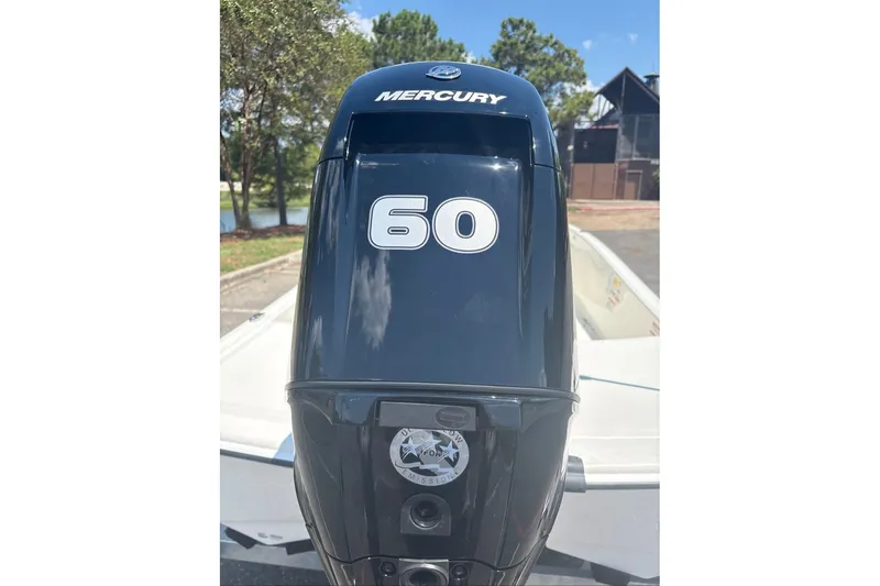 Slide: The Image of Mercury 60 horsepower outboard motor on 2026 Mako Pro Skiff 15 CC boat. - 1
