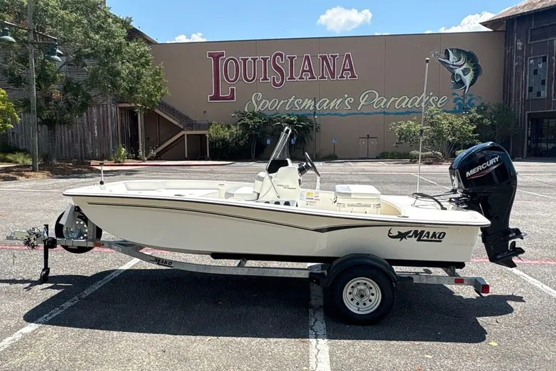 Slide: The Image of 2026 Mako Pro Skiff 15 CC boat on trailer, parked at Louisiana Sportsman's Paradise. - 4