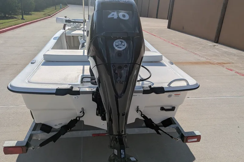 Slide: The Image of 2026 Mako Pro Skiff 13 CC with Mercury 40 HP engine on trailer. - 4