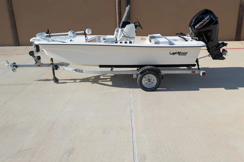 The Image of 2026 Mako Pro Skiff 13 CC boat on trailer with Mercury outboard motor. - 0