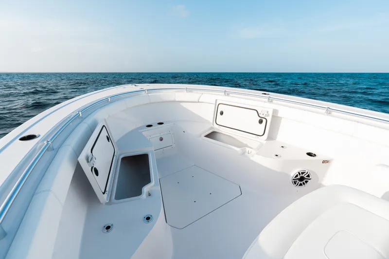 Slide: The Image of 2027 Sportsman Open 302 Center Console boat interior with open storage compartments at sea. - 5