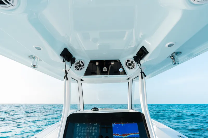 Slide: The Image of 2027 Sportsman Open 302 Center Console boat interior with ocean view. - 17