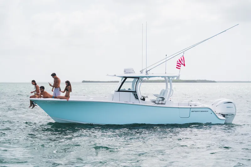 The Image of 2027 Sportsman Open 302 Center Console boat with people enjoying the ocean. - 0