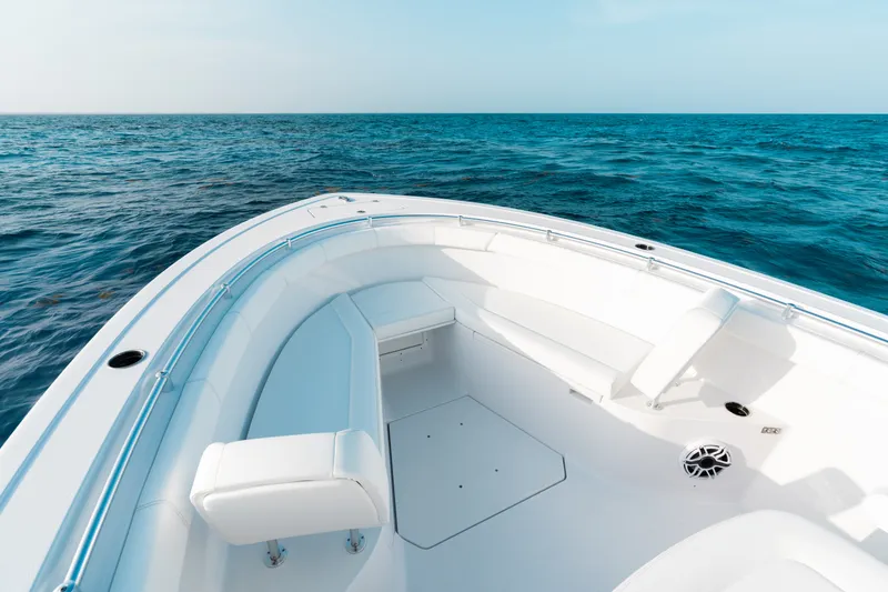 Slide: The Image of 2027 Sportsman Open 302 Center Console boat on open sea, featuring spacious seating. - 4