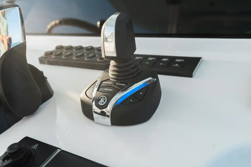 Slide: The Image of Joystick control on 2027 Sportsman Open 302 Center Console boat dashboard. - 16