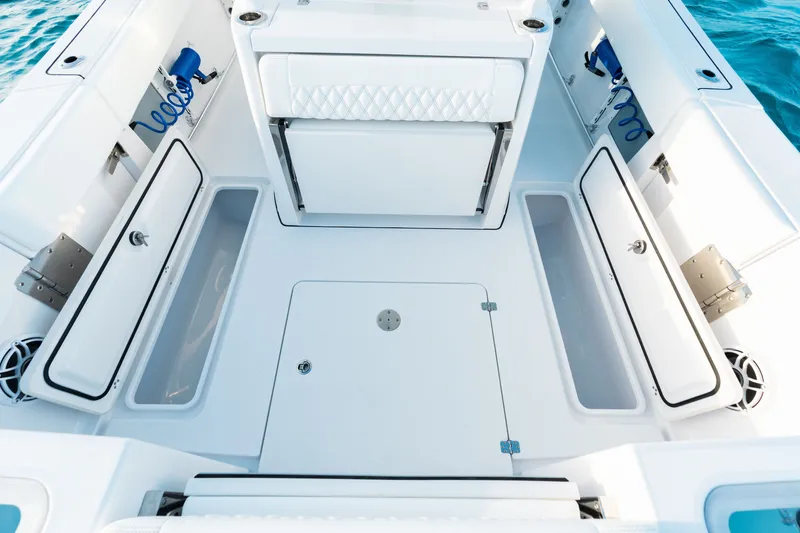 Slide: The Image of 2027 Sportsman Open 302 Center Console boat interior with storage compartments. - 23