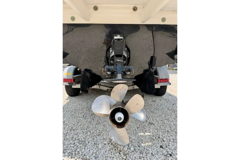 Slide: The Image of Rear view of 2013 Sea Ray 260 Sundeck boat propeller on gravel. - 30