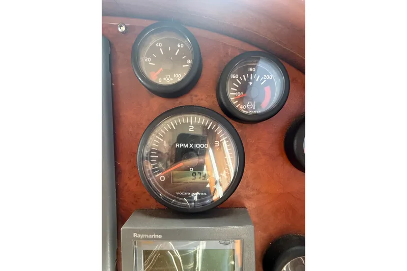 Slide: The Image of Close-up of 2006 Island Pilot 395 dashboard gauges and Raymarine display. - 24