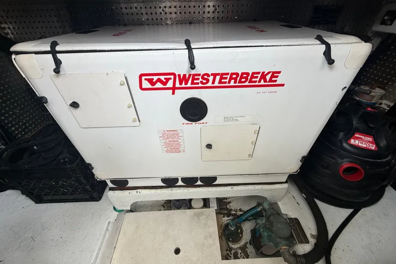Slide: The Image of Engine room of 2006 Island Pilot 395 with Westerbeke generator. - 44