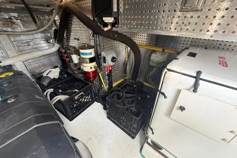 Slide: The Image of Engine room of 2006 Island Pilot 395 with equipment and storage crates. - 45