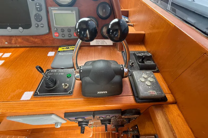 Slide: The Image of Control panel of a 2006 Island Pilot 395 boat with navigation instruments. - 22