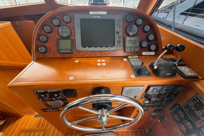Slide: The Image of Helm of 2006 Island Pilot 395 with navigation instruments and controls. - 20