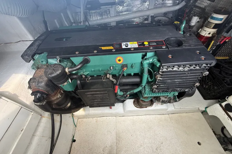 Slide: The Image of Engine compartment of a 2006 Island Pilot 395 boat, showcasing a well-maintained marine engine. - 43