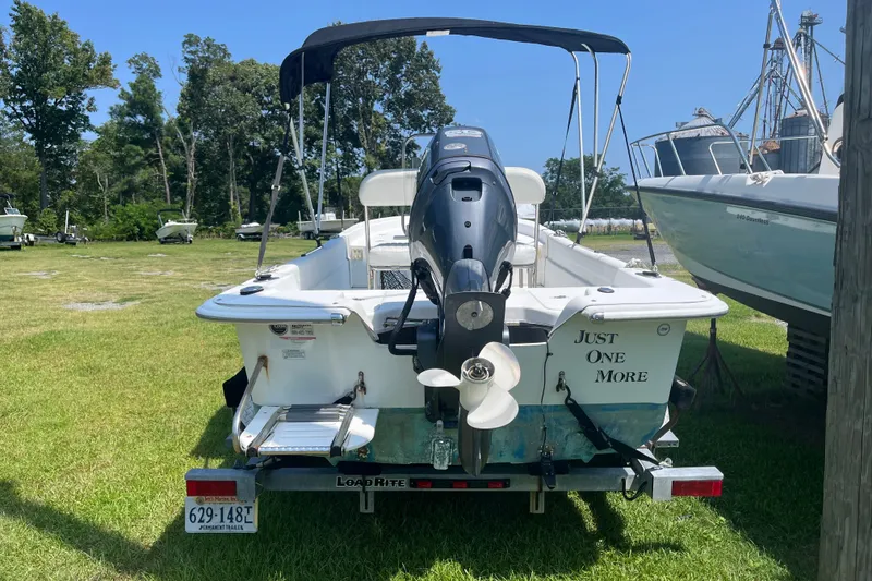 Slide: The Image of 2011 Carolina Skiff JVX16CC boat on trailer, rear view with outboard motor. - 19
