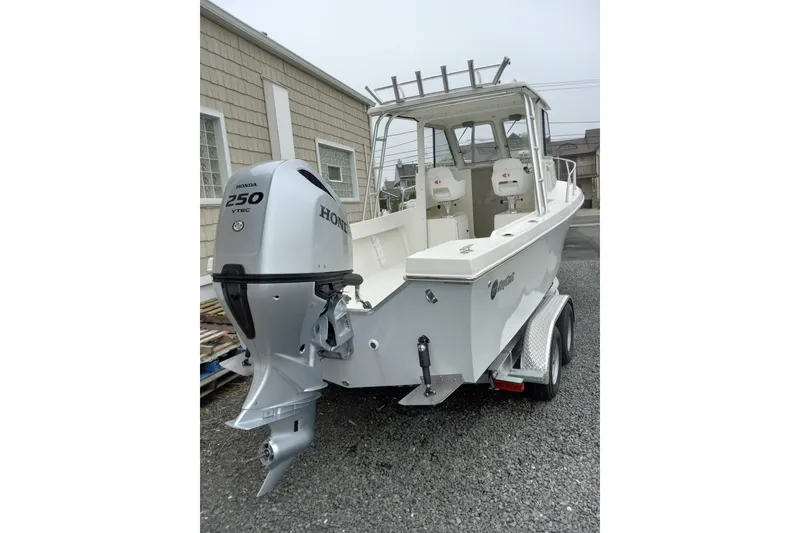 Slide: The Image of 2022 May-Craft 2300 Pilot House boat with Honda 250 VTEC engine on trailer. - 10