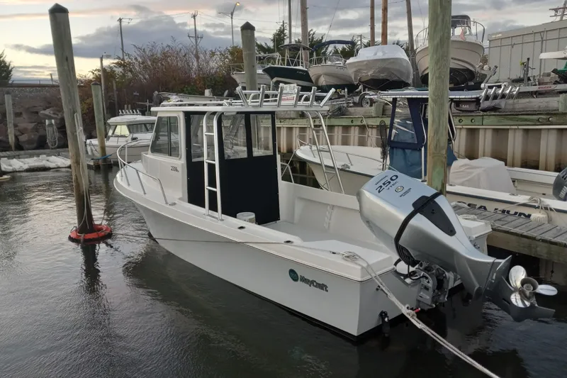Slide: The Image of 2022 May-Craft 2300 Pilot House boat docked with Yamaha 250 engine. - 5