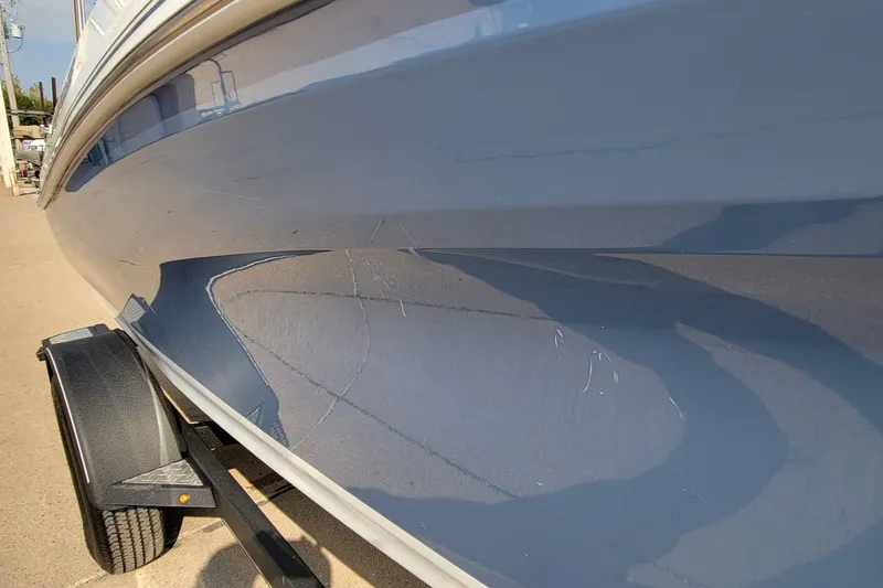 Slide: The Image of 2022 Tahoe 185 S boat hull on trailer, showing sleek blue design. - 20