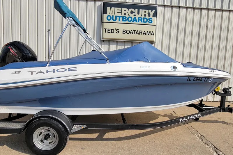 Slide: The Image of 2022 Tahoe 185 S boat with blue cover on trailer at Ted's Boatarama. - 35