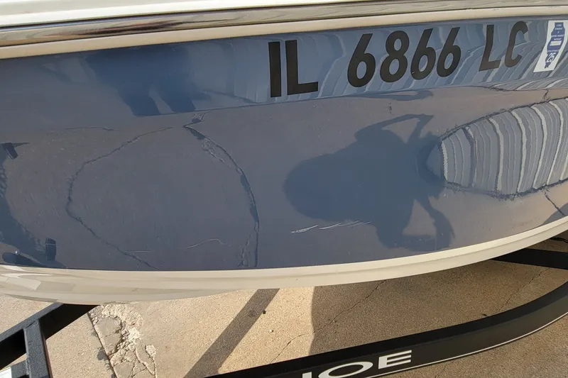 Slide: The Image of 2022 Tahoe 185 S boat with registration IL 6866 LC, docked on a trailer. - 16