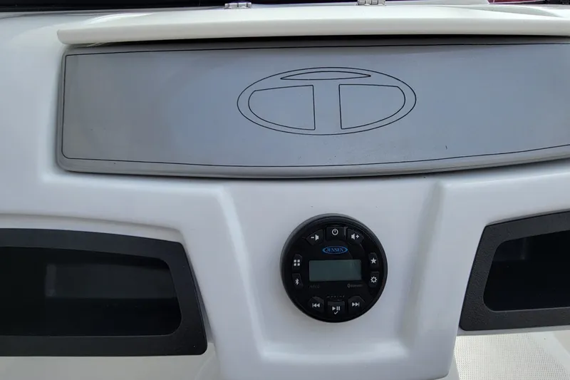 Slide: The Image of Dashboard of a 2022 Tahoe 185 S boat with Jensen audio system. - 31