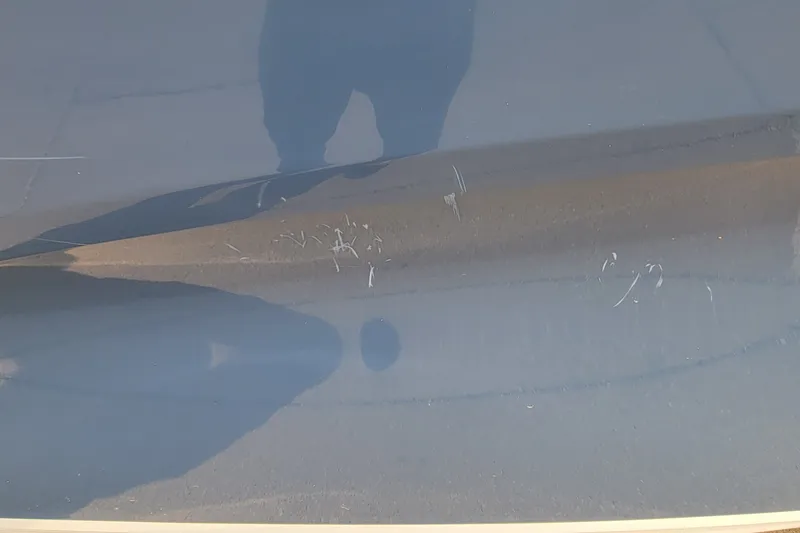 Slide: The Image of Scratches on the surface of a 2022 Tahoe 185 S boat. - 19