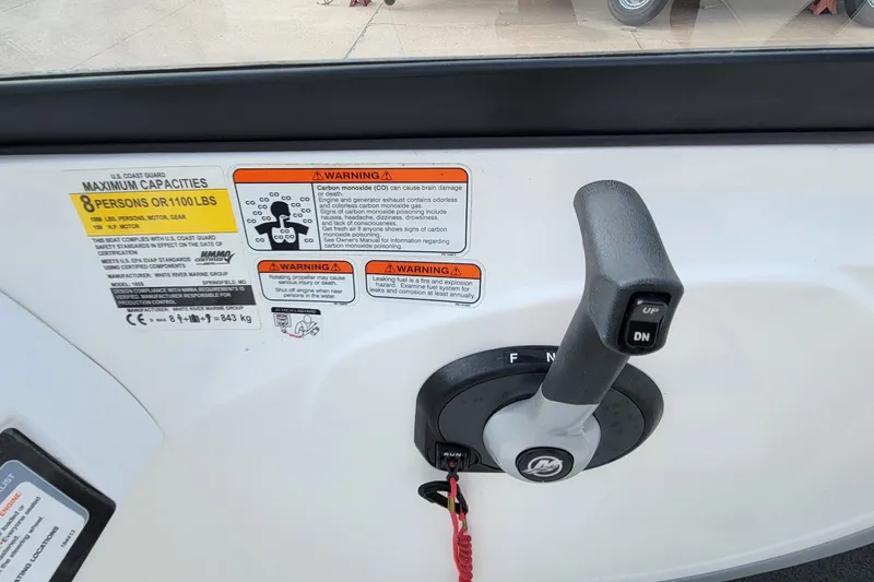 Slide: The Image of Control panel of a 2022 Tahoe 185 S boat with capacity warnings. - 28
