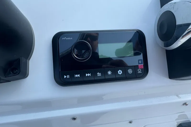 Slide: The Image of Control panel of a 2027 Stingray 17 CC boat with various function buttons. - 13