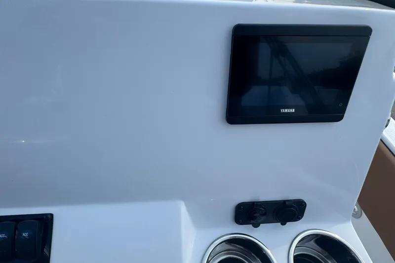 Slide: The Image of Dashboard of a 2027 Stingray 17 CC boat with Yamaha display and controls. - 12