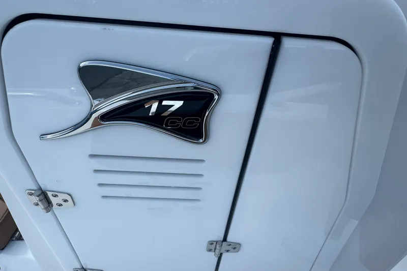 Slide: The Image of 2027 Stingray 17 CC boat emblem on white surface. - 16