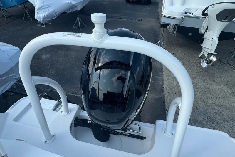 Slide: The Image of 2027 Stingray 17 CC boat engine, docked with protective covers visible. - 5
