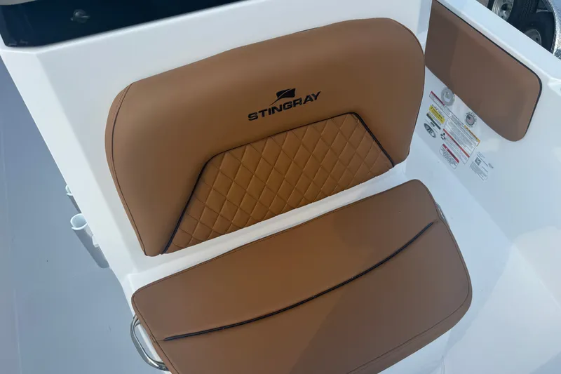 Slide: The Image of Brown leather seat on 2027 Stingray 17 CC boat interior. - 21