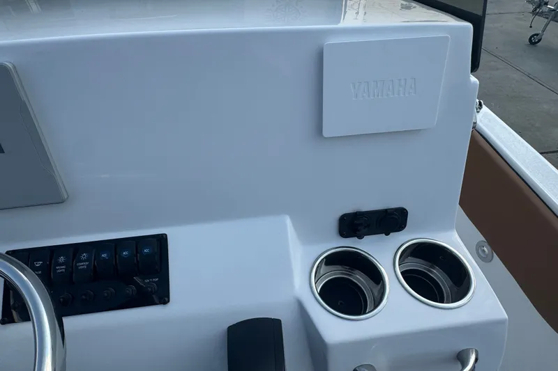Slide: The Image of Console of a 2027 Stingray 17 CC boat with Yamaha panel and cup holders. - 10