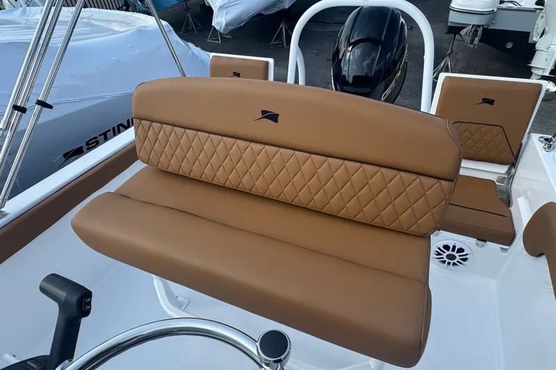 Slide: The Image of 2027 Stingray 17 CC boat with tan quilted seating and sleek design. - 8