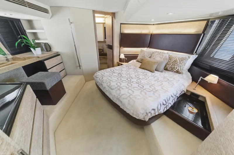 Slide: The Image of Luxurious bedroom interior of 2010 Azimut 58 yacht with modern decor and cozy bedding. - 88