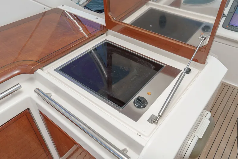 Slide: The Image of Built-in stove on 2010 Azimut 58 yacht, featuring sleek wooden and stainless steel design. - 46