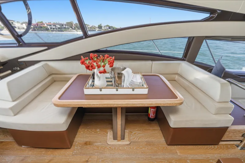 Slide: The Image of Luxurious interior of 2010 Azimut 58 yacht with elegant seating and table setting. - 66