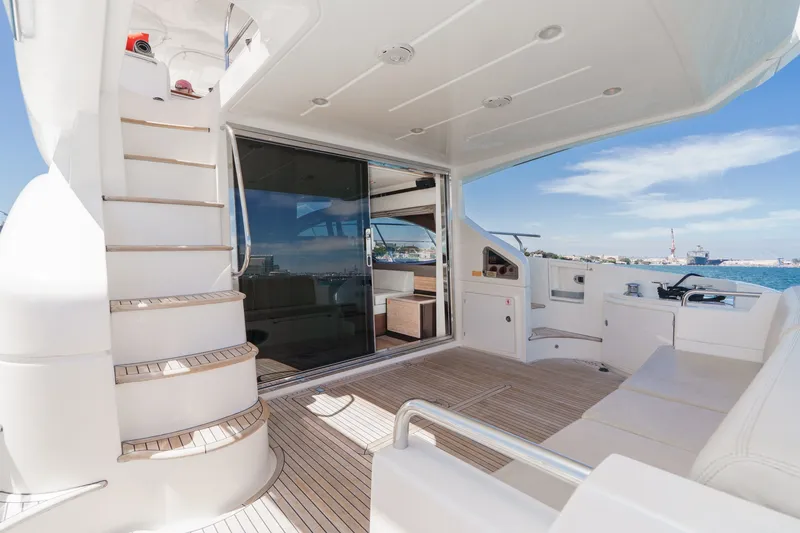 Slide: The Image of Luxurious 2010 Azimut 58 yacht interior with elegant seating and ocean view. - 56