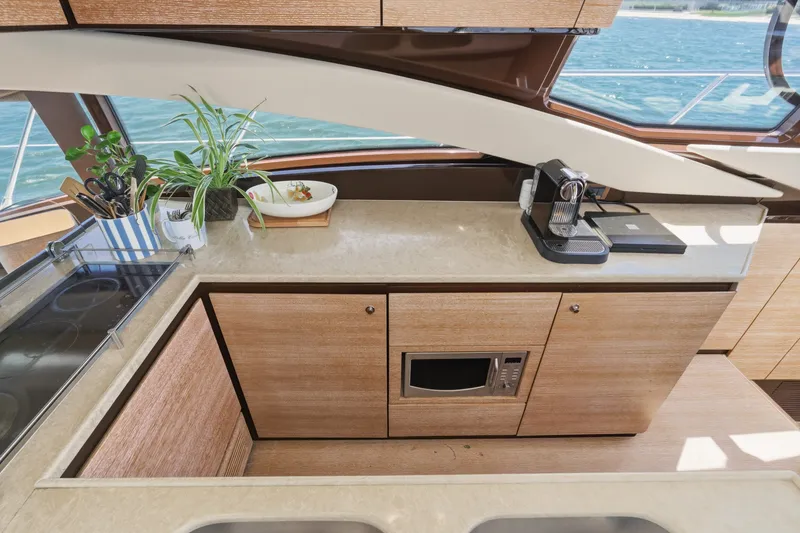 Slide: The Image of Luxurious kitchen interior of 2010 Azimut 58 yacht with modern appliances and ocean view. - 71