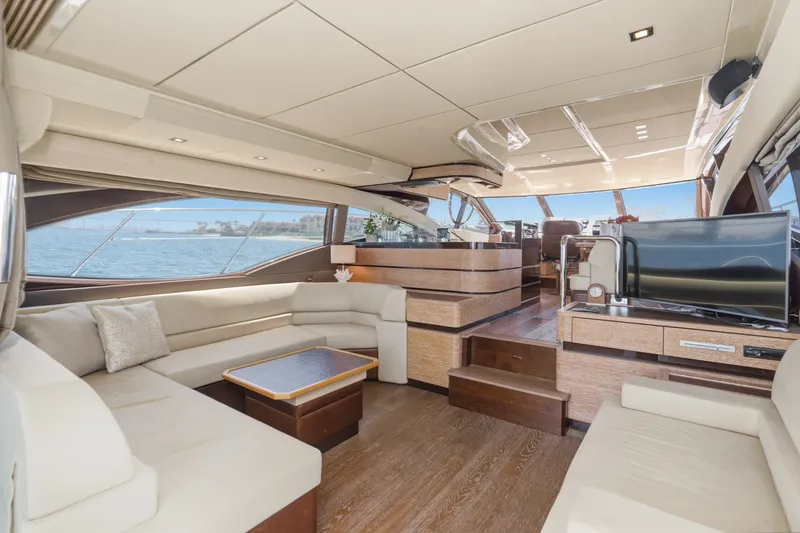 Slide: The Image of Luxurious interior of a 2010 Azimut 58 yacht with elegant seating and panoramic windows. - 59
